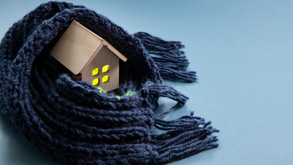 cosy wooden toy home wrapped in scarf